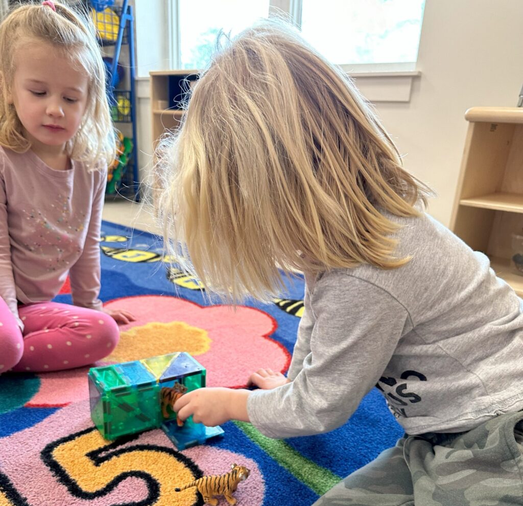 Two blonde headed children playing