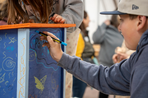 Boys painting table.
